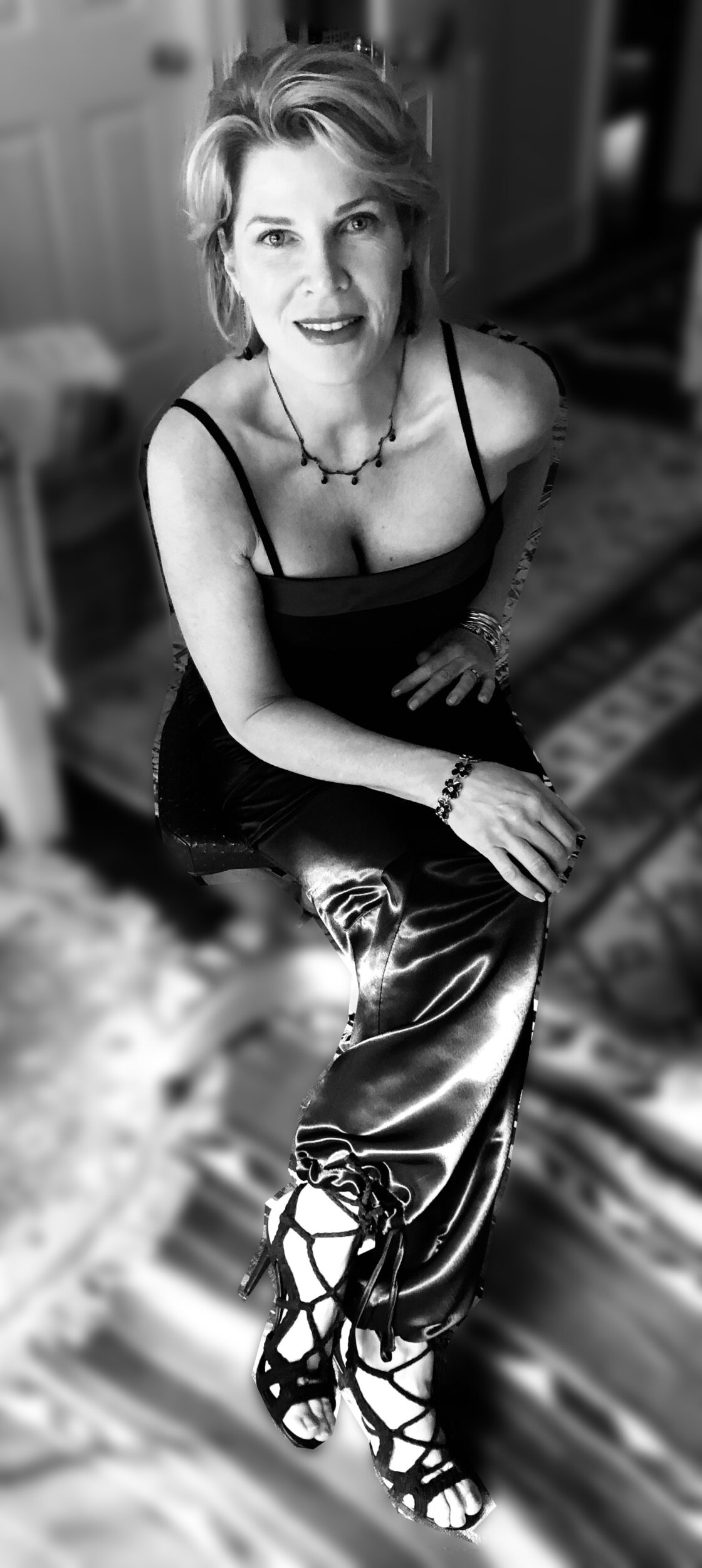 Nini in Black in Chair with shoes